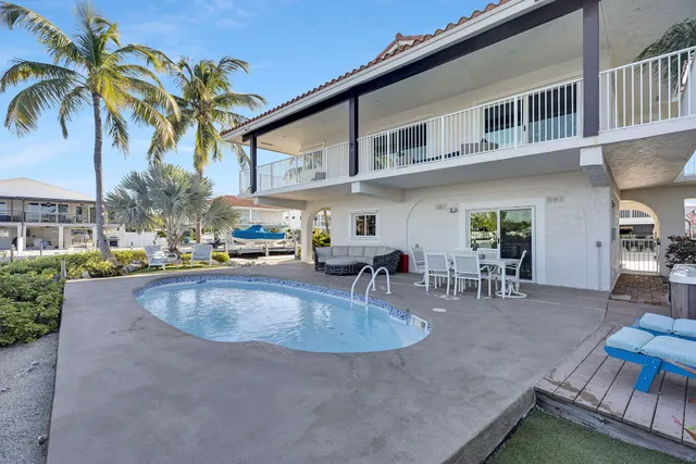 a view of outdoor kitchen with outdoor seating