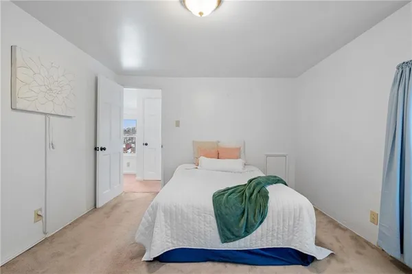 a room with a bed and a window