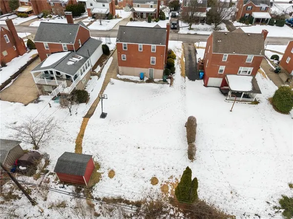 an aerial view of a backyard of a house