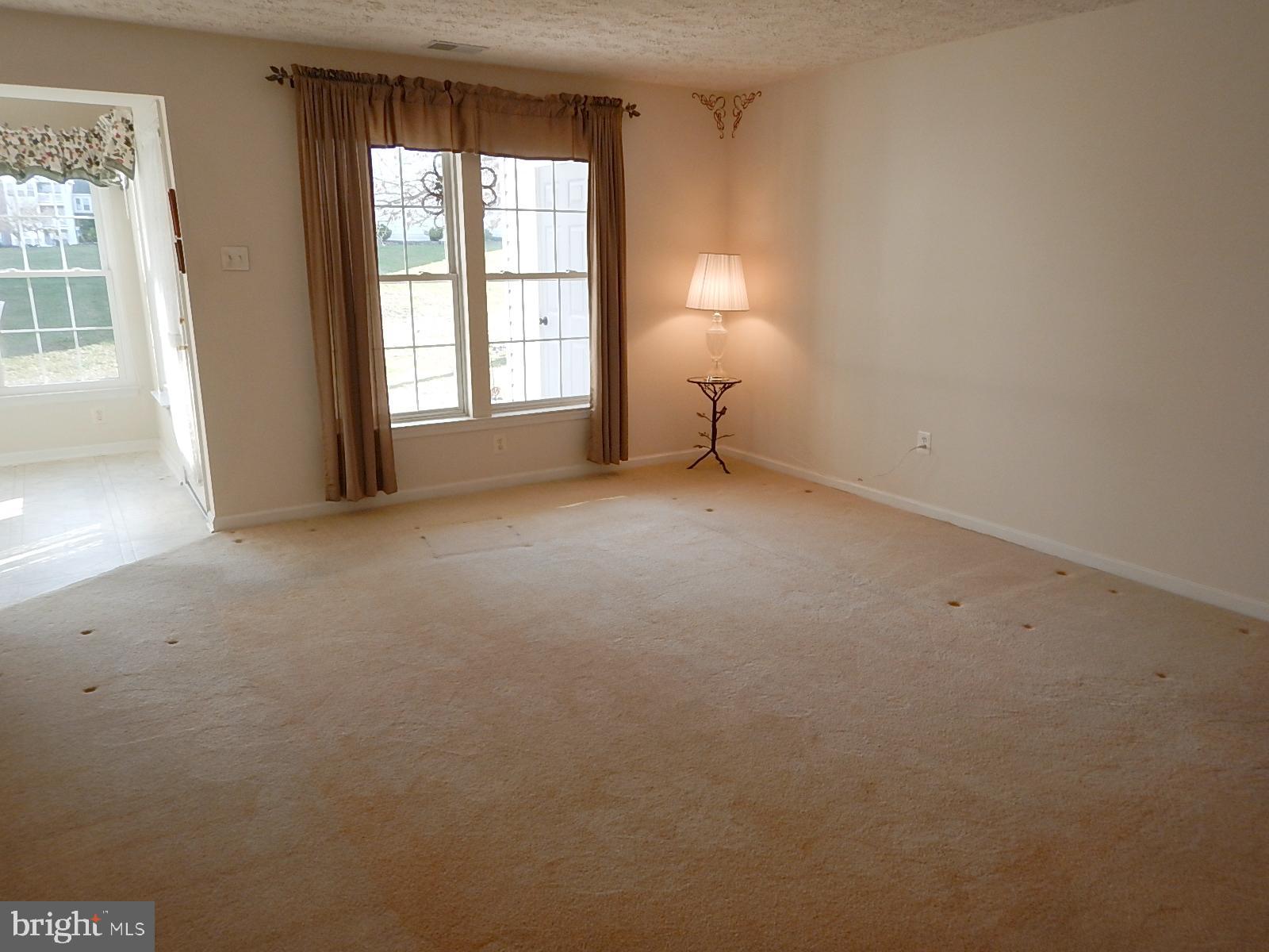 4513 Aspen Mill Road, Unit 4513 Nottingham, MD 21236 - Photo 9 of 25 Living Room view, windows overlook the patio