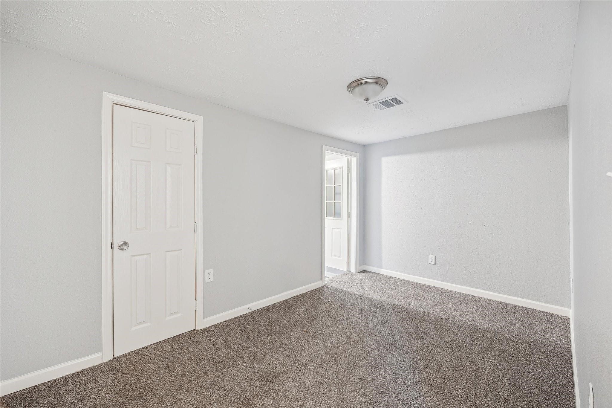 710 East Magnolia Street Angleton, TX 77515 - Photo 6 of 9 a view of an empty room with a window