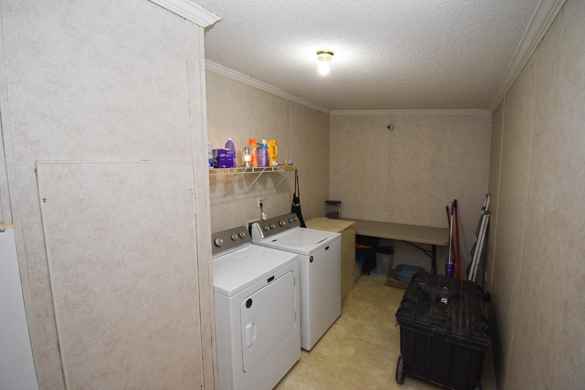 8484 Creek Road Willow Spring, NC 27592 - Photo 10 of 33 a room with a sink and cabinets