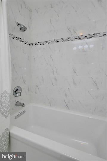 7012 Hadlow Drive Springfield, VA 22152 - Photo 12 of 21 a bathroom with a bathtub and a shower