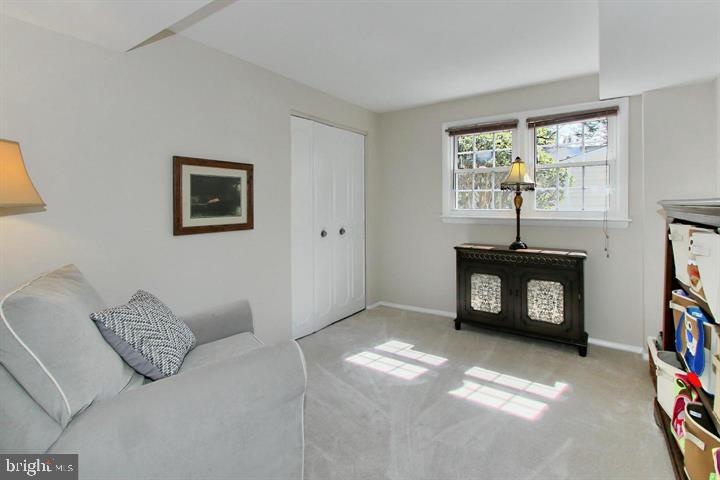 7012 Hadlow Drive Springfield, VA 22152 - Photo 17 of 21 a living room with furniture a window and a flat screen tv