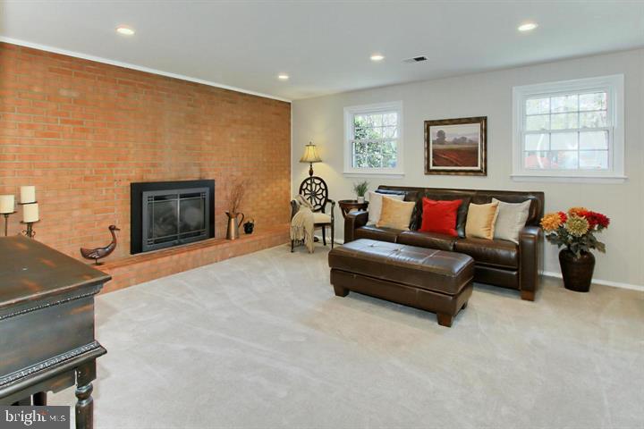 7012 Hadlow Drive Springfield, VA 22152 - Photo 20 of 21 a living room with furniture and a fireplace