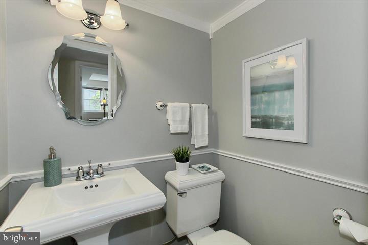 7012 Hadlow Drive Springfield, VA 22152 - Photo 21 of 21 a bathroom with a sink a mirror and a toilet