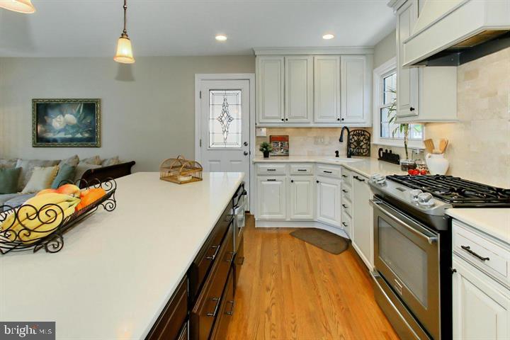 7012 Hadlow Drive Springfield, VA 22152 - Photo 4 of 21 a kitchen with a stove a sink and a refrigerator