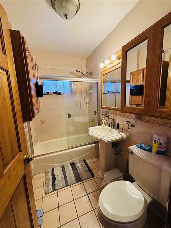 24 Meacham Street, Unit 2 Somerville, MA 02145 - Photo 11 of 11 a bathroom with a sink toilet and shower