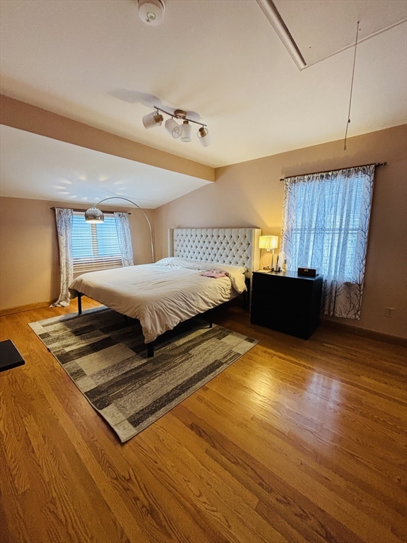 24 Meacham Street, Unit 2 Somerville, MA 02145 - Photo 4 of 11 a bedroom with double bed and a dresser