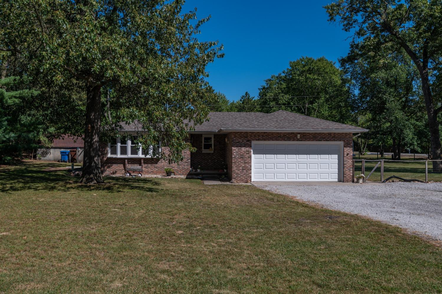 7133 Tranquility Drive Demotte, IN 46310 - Photo 1 of 1 a house with a yard