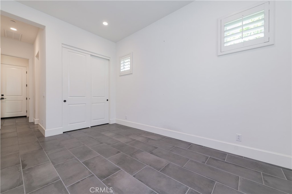 91 Rockinghorse Irvine, CA 92602 - Photo 21 of 48 an empty room with windows and closet
