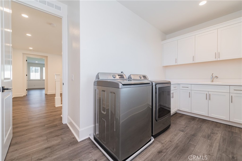 91 Rockinghorse Irvine, CA 92602 - Photo 26 of 48 a utility room with sink dryer and washer