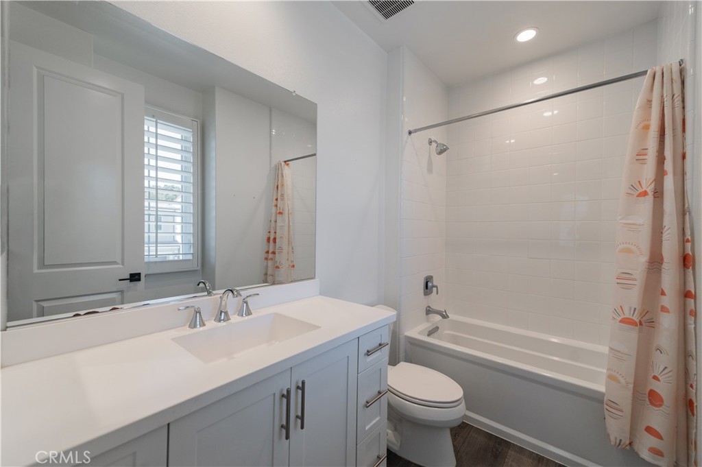 91 Rockinghorse Irvine, CA 92602 - Photo 29 of 48 a bathroom with a sink a toilet a mirror a vanity and shower
