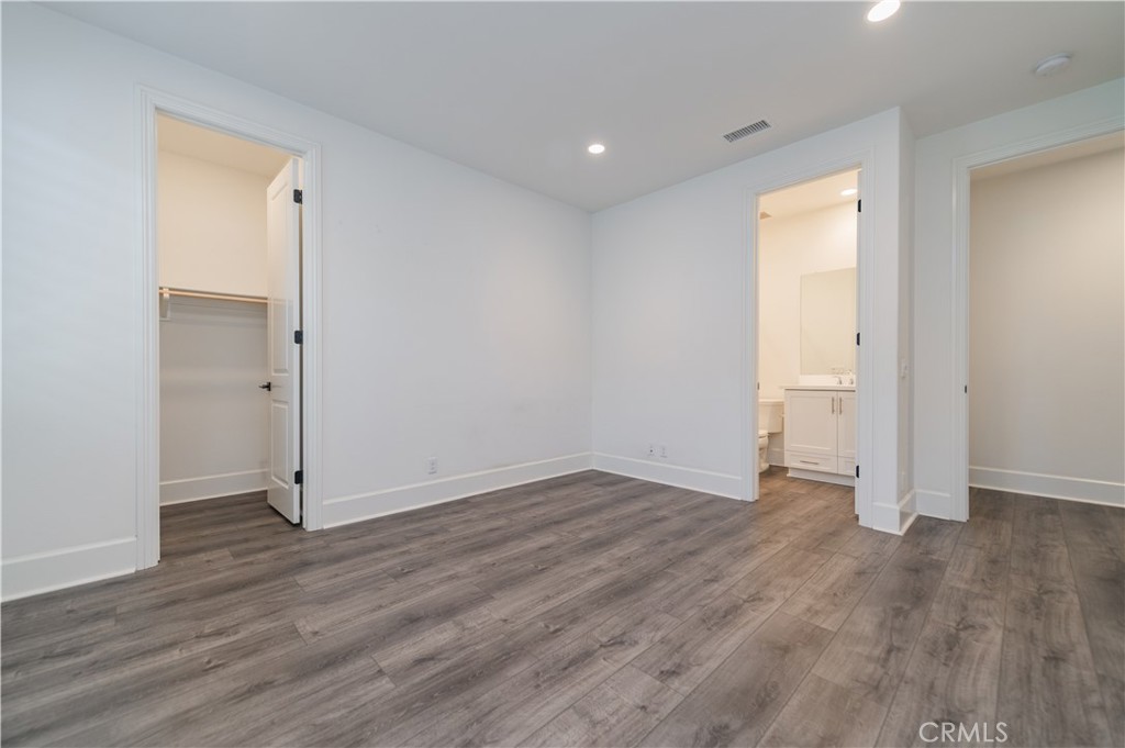 91 Rockinghorse Irvine, CA 92602 - Photo 31 of 48 wooden floor in an empty room with a window
