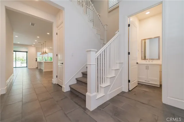 a view of entryway and hall with a living room