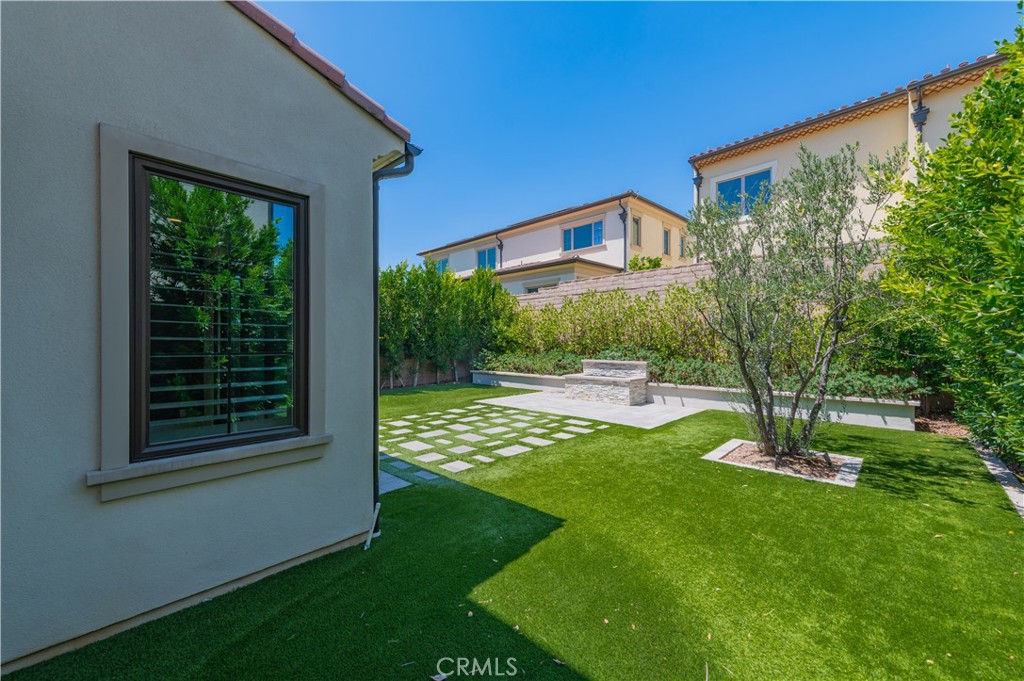 91 Rockinghorse Irvine, CA 92602 - Photo 46 of 48 a view of a house with a yard porch and sitting area