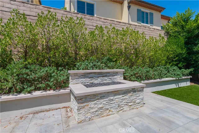 a view of a garden with an outdoor seating