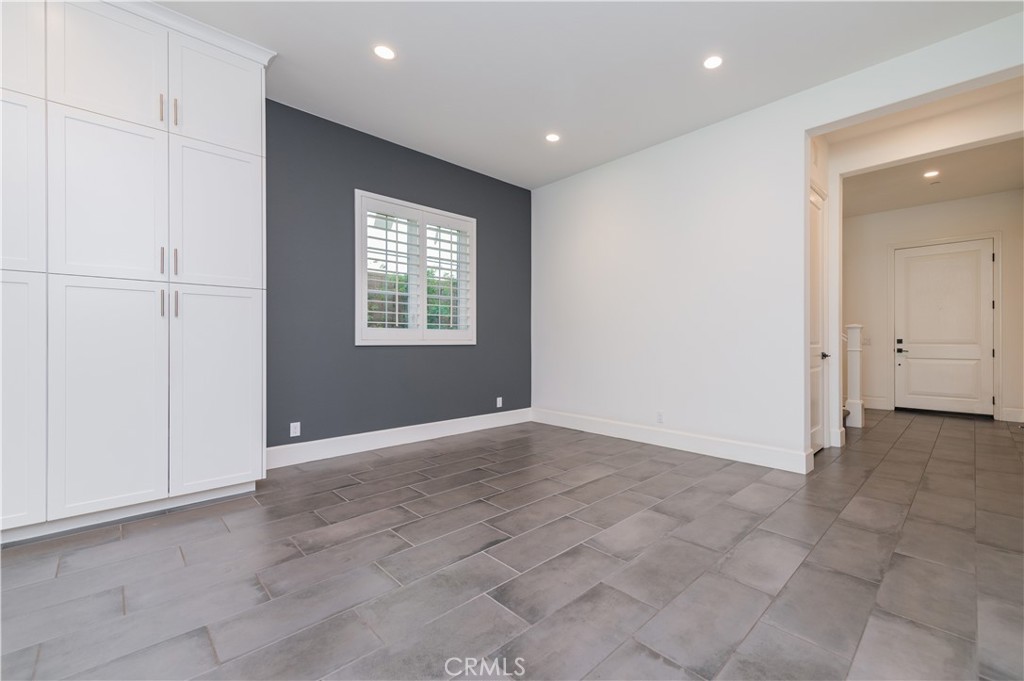 91 Rockinghorse Irvine, CA 92602 - Photo 8 of 48 an empty room with windows and closet