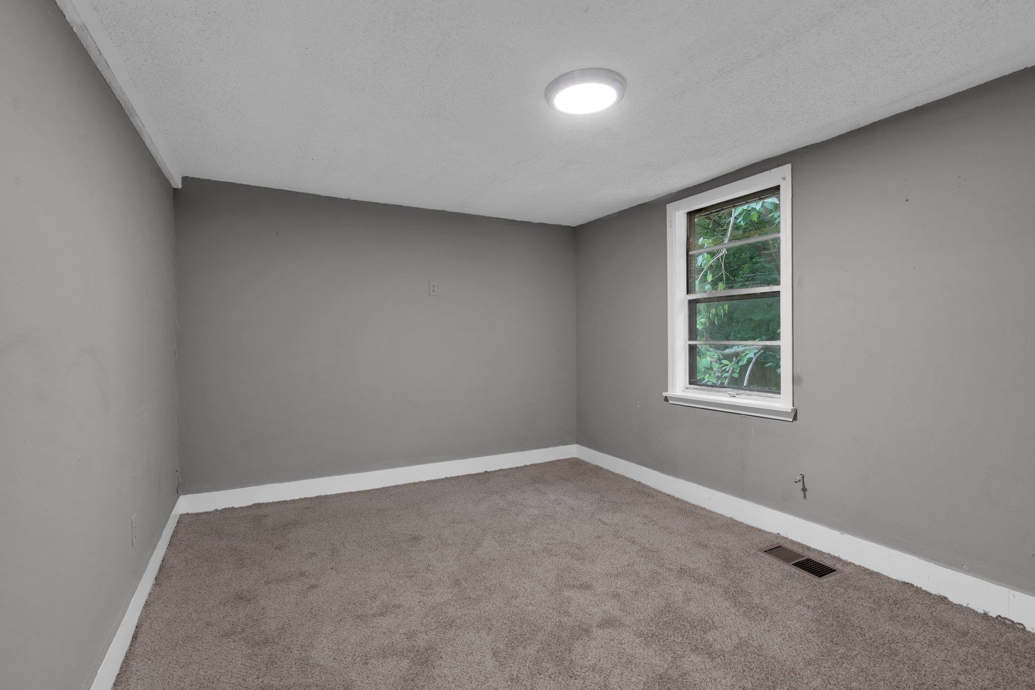 76 Bucksnort Road Covington, TN 38019 - Photo 11 of 21 Carpeted spare room with a textured ceiling