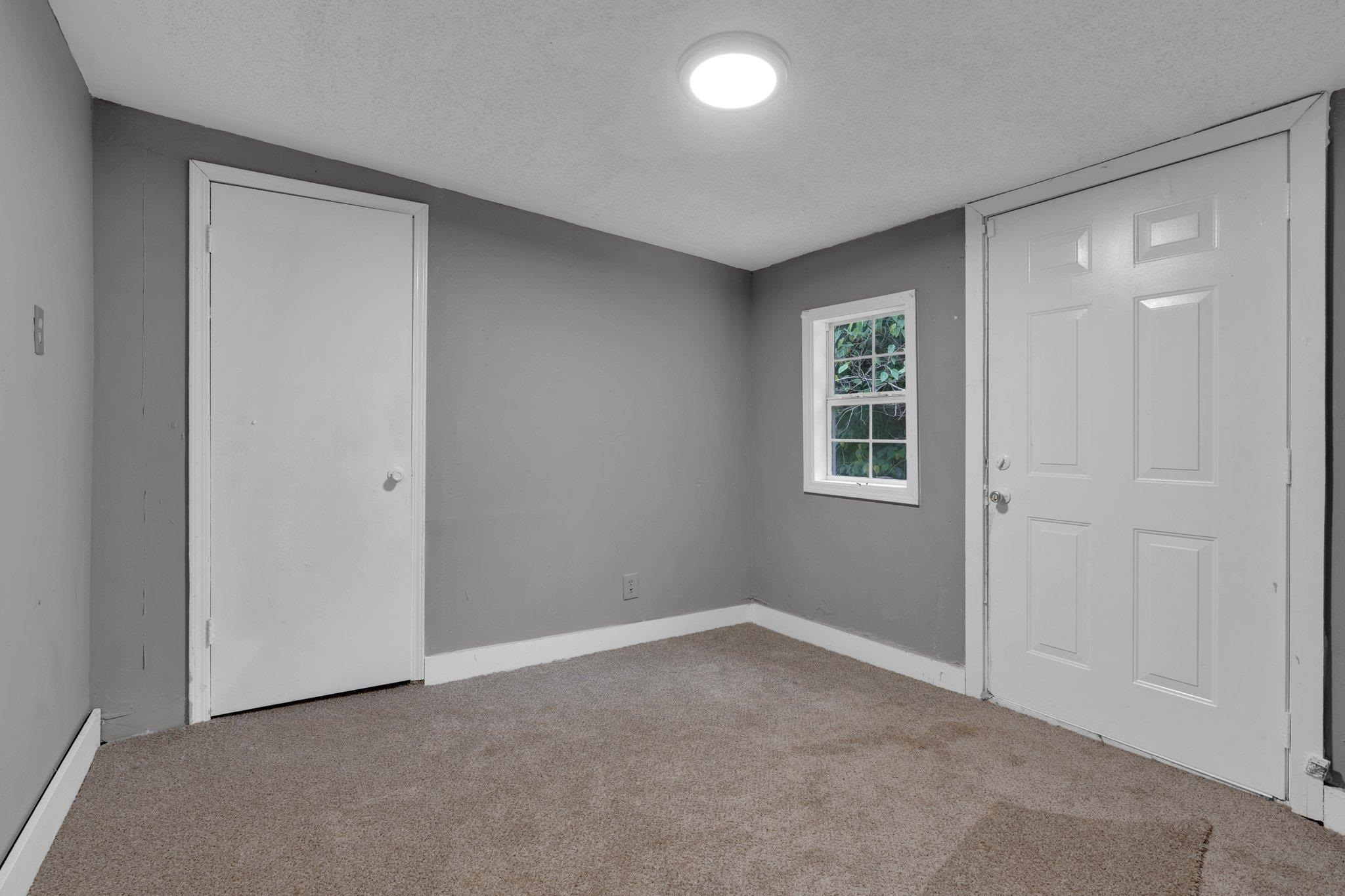 76 Bucksnort Road Covington, TN 38019 - Photo 19 of 21 Carpeted empty room with a textured ceiling