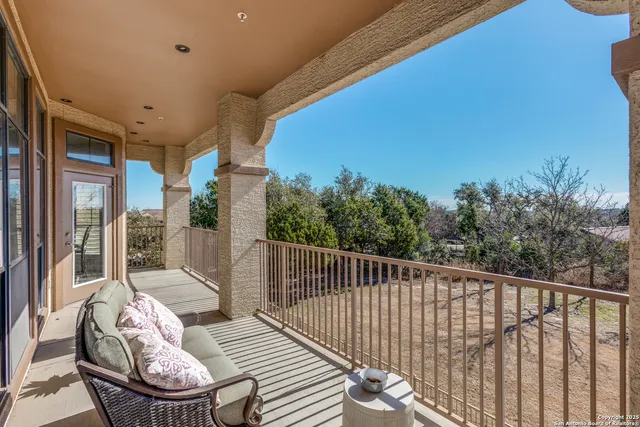 a view of a balcony with furniture