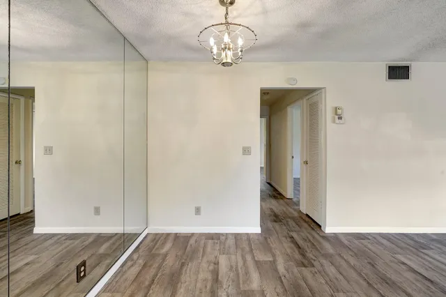 a view of livingroom with hardwood floor and hallway