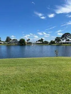 a view of a lake with houses in the back