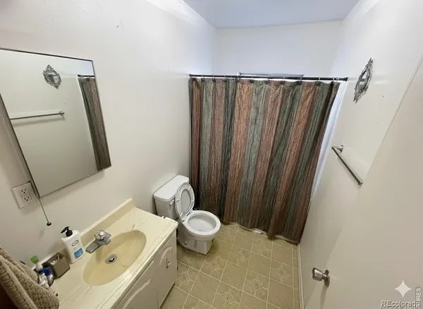 a bathroom with a sink and toilet