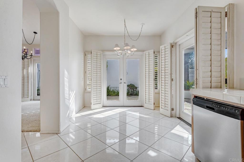 4144 Andros Way Oceanside, CA 92056 - Photo 12 of 29 a view of a hallway with windows and chandelier