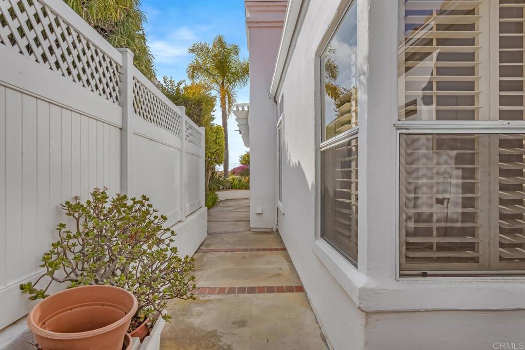 4144 Andros Way Oceanside, CA 92056 - Photo 24 of 29 a view of a house with a potted plant and floor to ceiling window