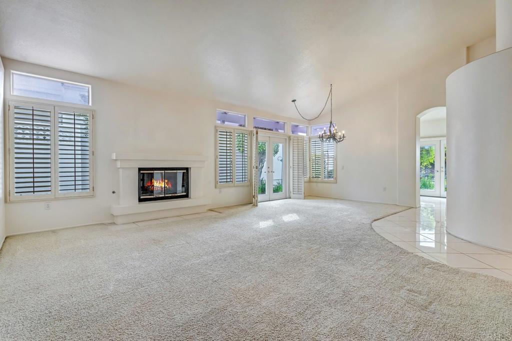 4144 Andros Way Oceanside, CA 92056 - Photo 5 of 29 a view of a livingroom with wooden floor and a fireplace
