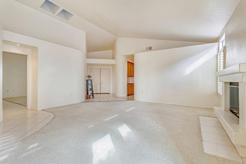 4144 Andros Way Oceanside, CA 92056 - Photo 7 of 29 a view of a hallway with a kitchen