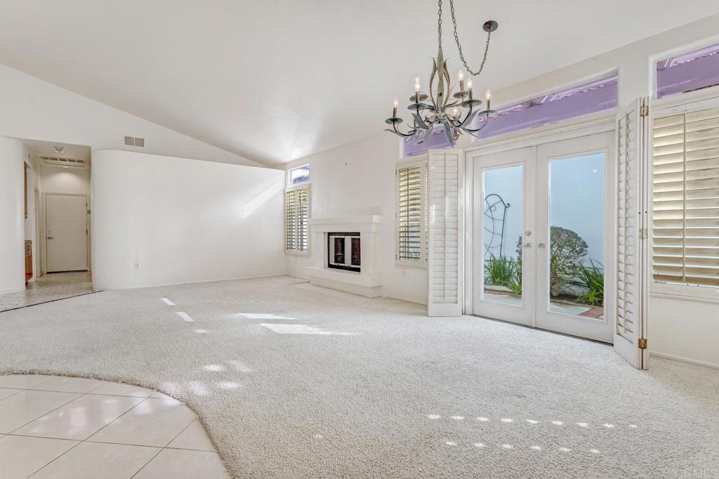4144 Andros Way Oceanside, CA 92056 - Photo 8 of 29 a view of a livingroom with a chandelier fan and windows