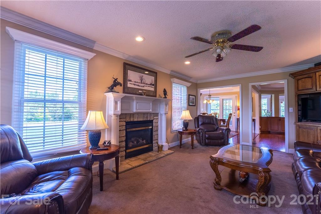 178 Buck Fraley Road Cherryville, NC 28021 - Photo 22 of 47 a living room with furniture and a fireplace