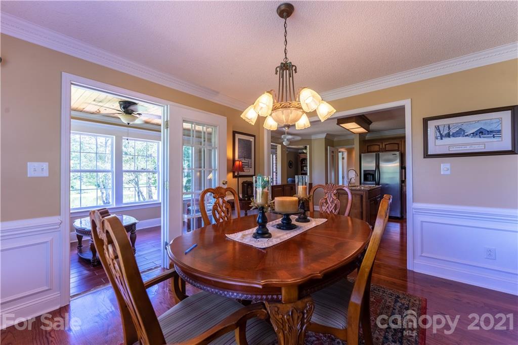 178 Buck Fraley Road Cherryville, NC 28021 - Photo 25 of 47 a view of a dining room with furniture a chandelier and wooden floor