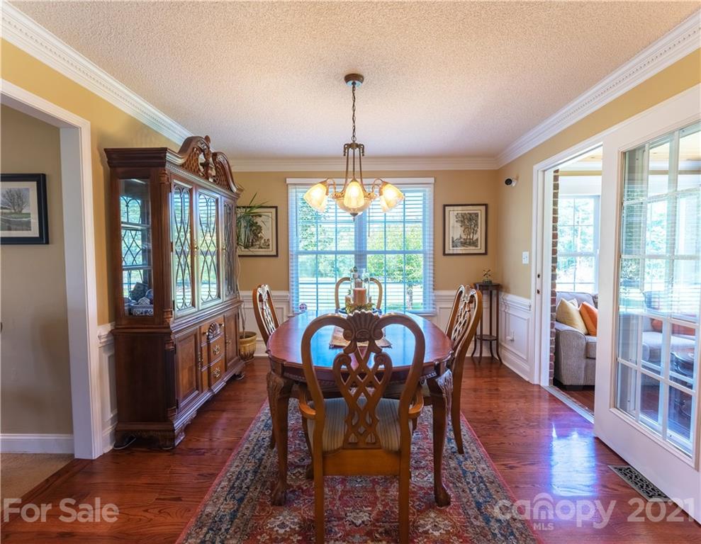 178 Buck Fraley Road Cherryville, NC 28021 - Photo 26 of 47 a view of a dining room with furniture window and wooden floor