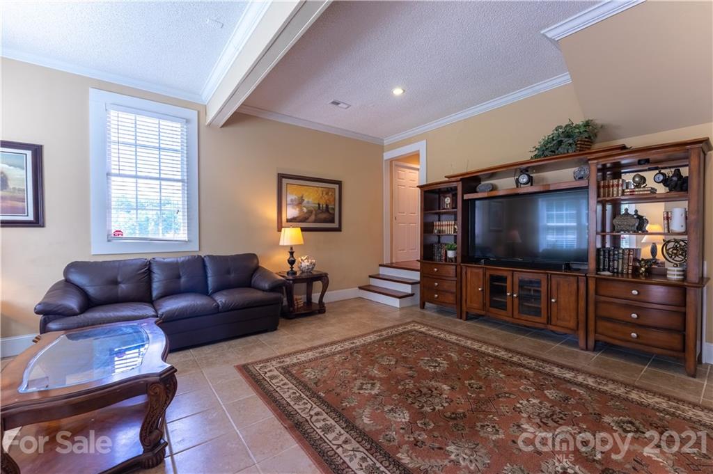 178 Buck Fraley Road Cherryville, NC 28021 - Photo 35 of 47 a living room with furniture and a flat screen tv