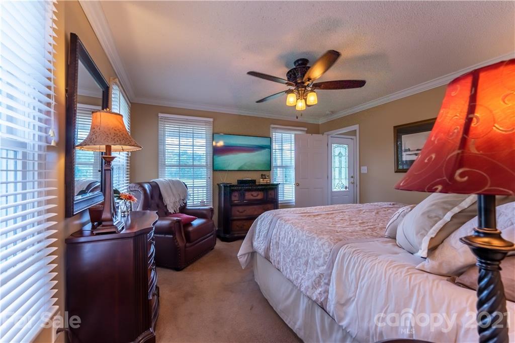 178 Buck Fraley Road Cherryville, NC 28021 - Photo 38 of 47 a bedroom with a bed and wooden floor