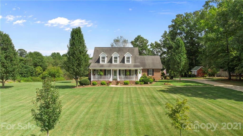 178 Buck Fraley Road Cherryville, NC 28021 - Photo 5 of 47 a view of a house with a big yard and large trees