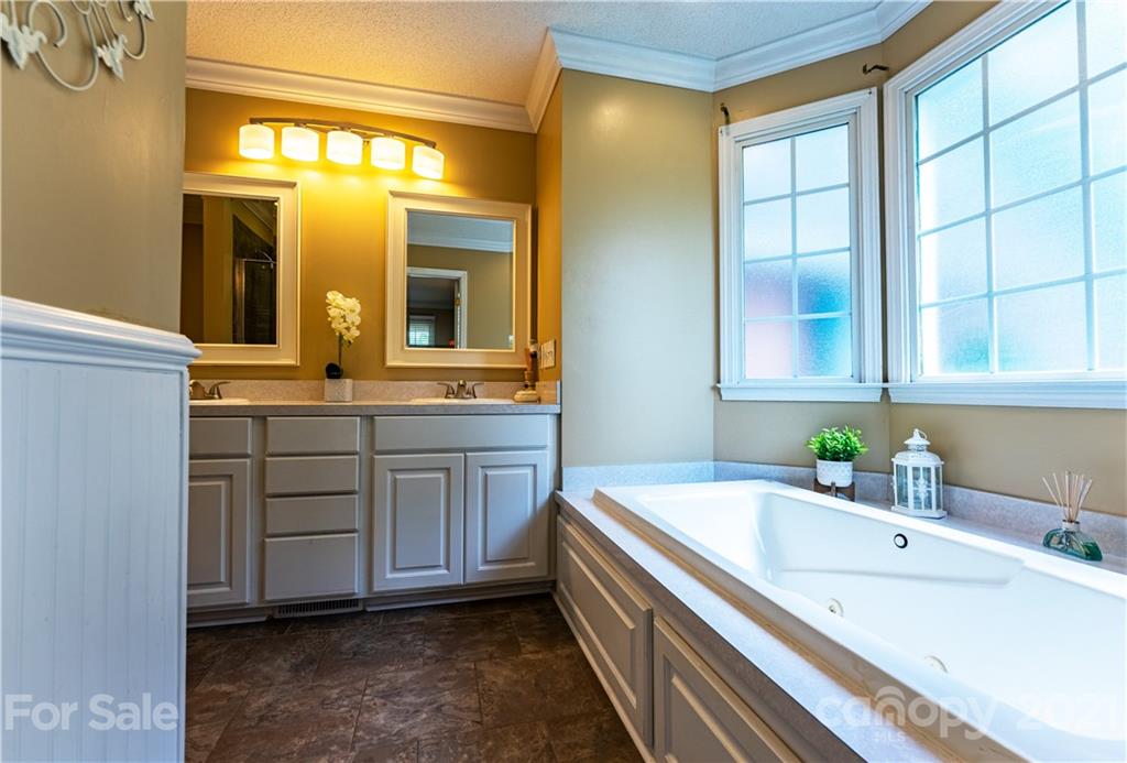 178 Buck Fraley Road Cherryville, NC 28021 - Photo 42 of 47 a bathroom with a tub sink and mirror