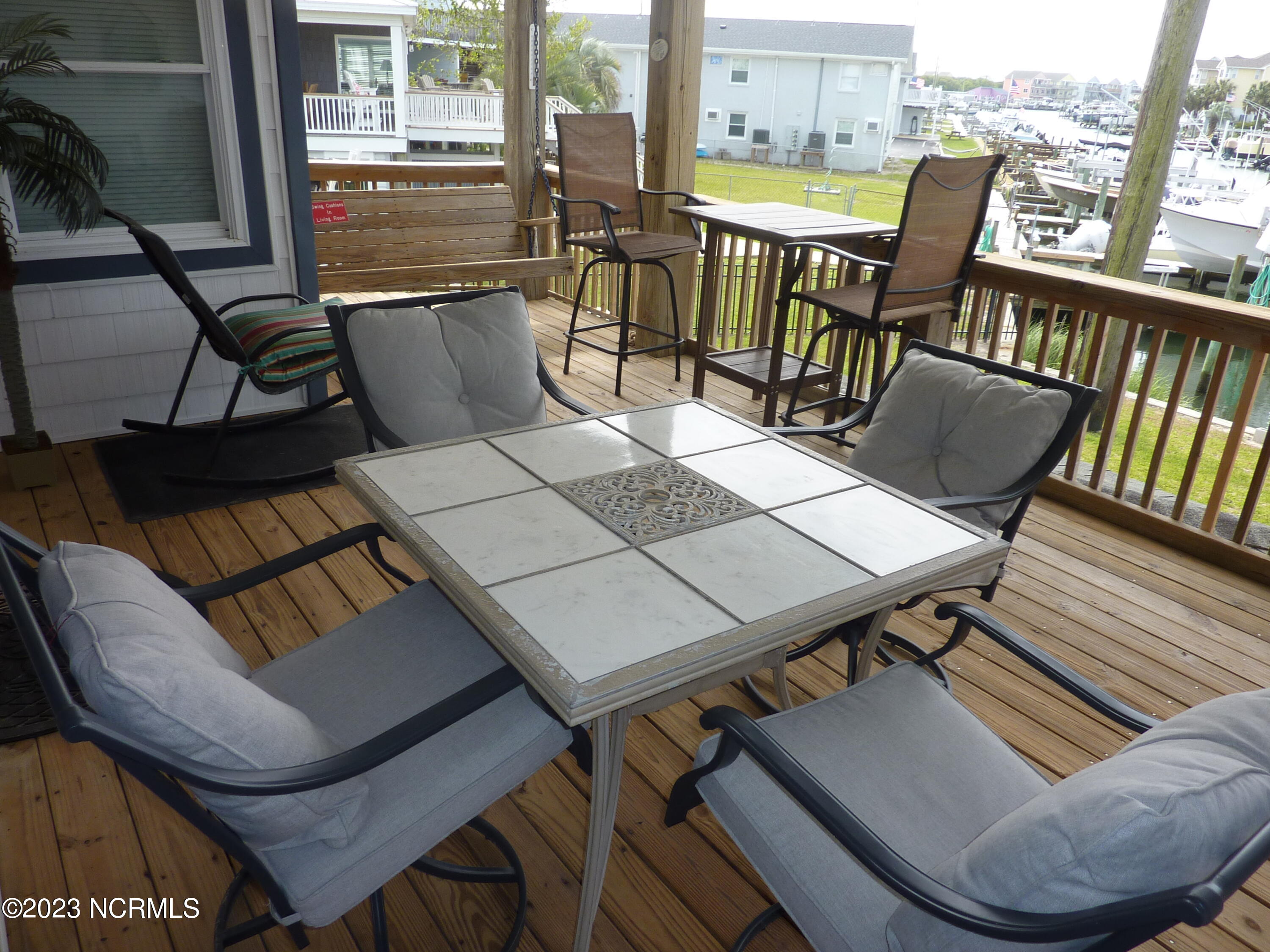 103 Pond Drive Atlantic Beach, NC 28512 - Photo 4 of 15 Covered Deck With Outdoor Furniture