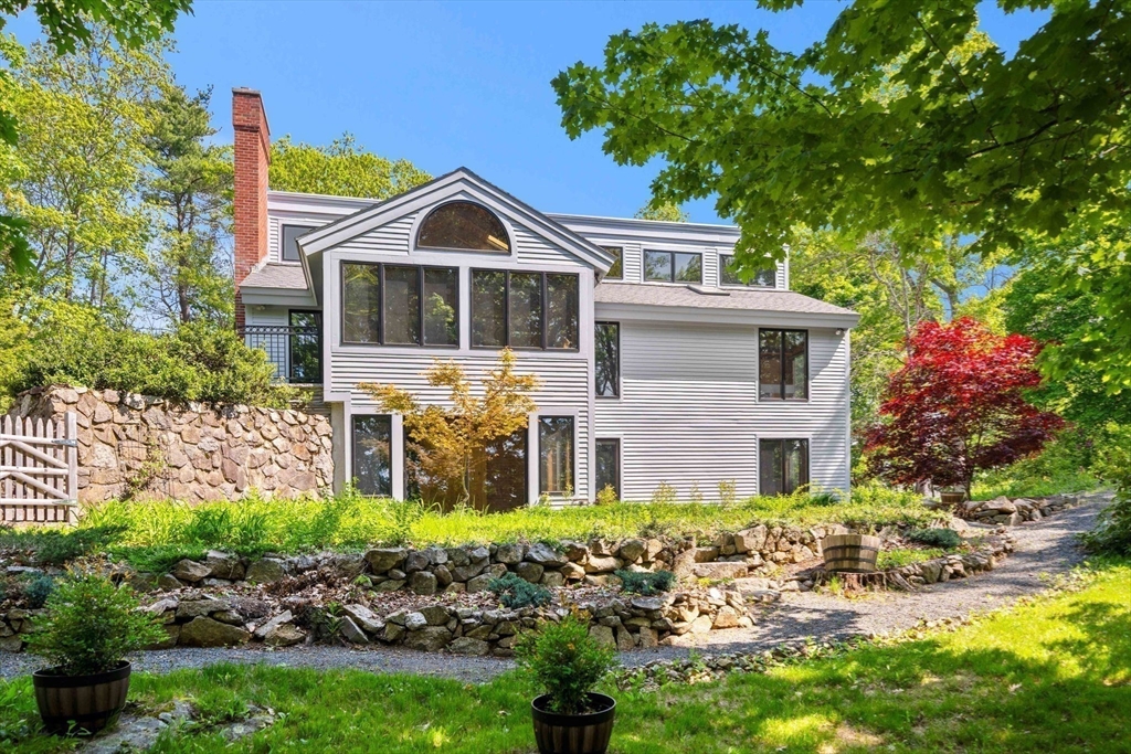 3 Whitman Place Beverly, MA 01915 - Photo 1 of 34 a front view of a house with a yard and garage