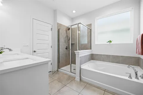 a bathroom with a bathtub and a sink