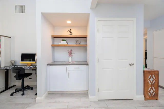 a view of workspace with cabinets