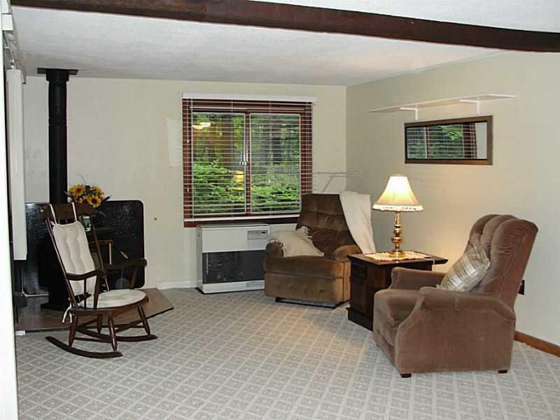 25 Hawk Road Bridgton, ME 04009 - Photo 14 of 28 Living Room. Wood Stove and monitor...
