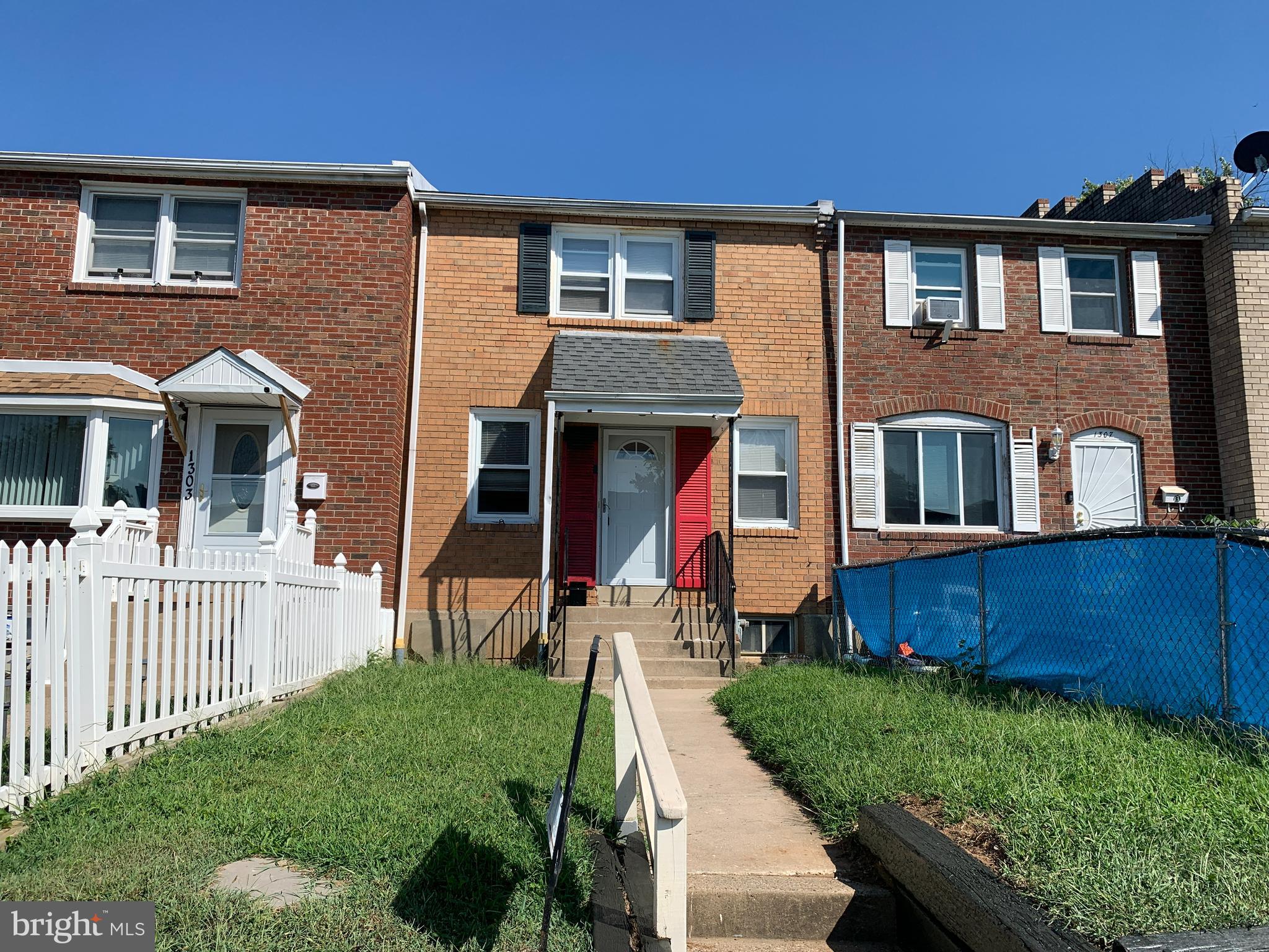 1305 Harshaw Road Brookhaven, PA 19015 - Photo 1 of 25 a front view of a house with a yard