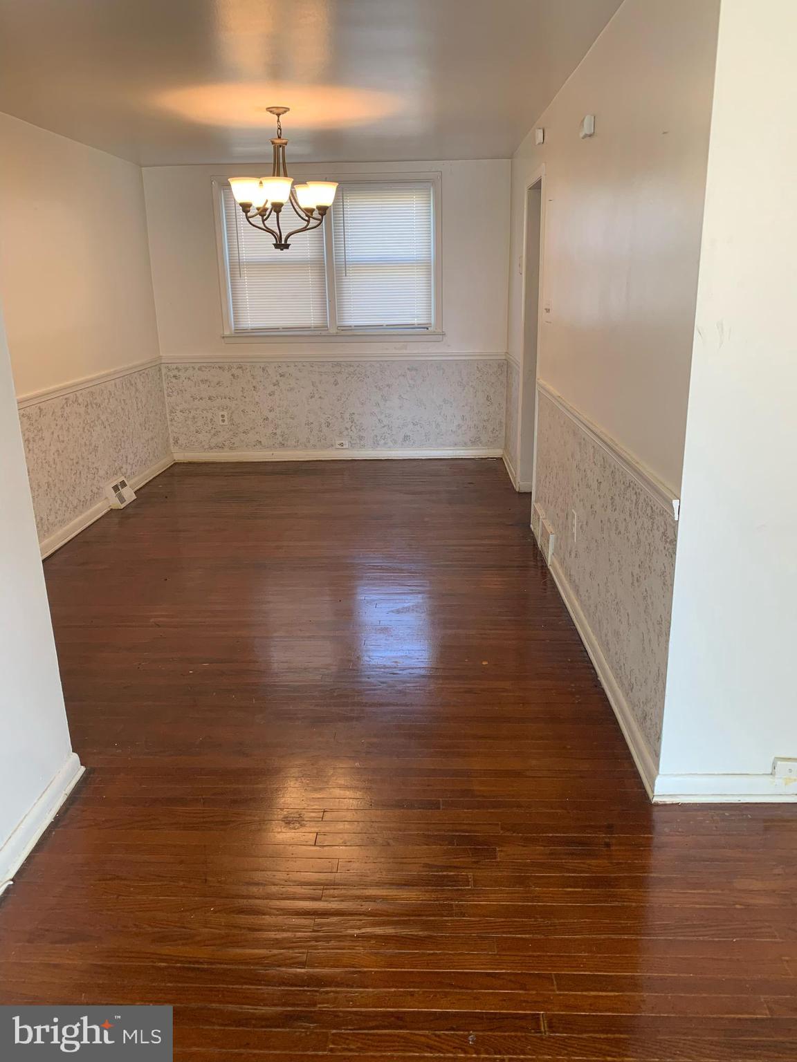 1305 Harshaw Road Brookhaven, PA 19015 - Photo 3 of 25 a view of empty room with wooden floor