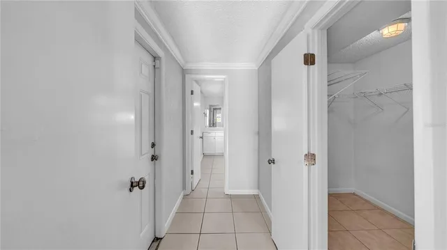 a bathroom with a shower and a glass door