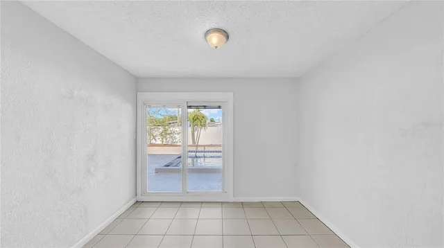 a view of an empty room and window