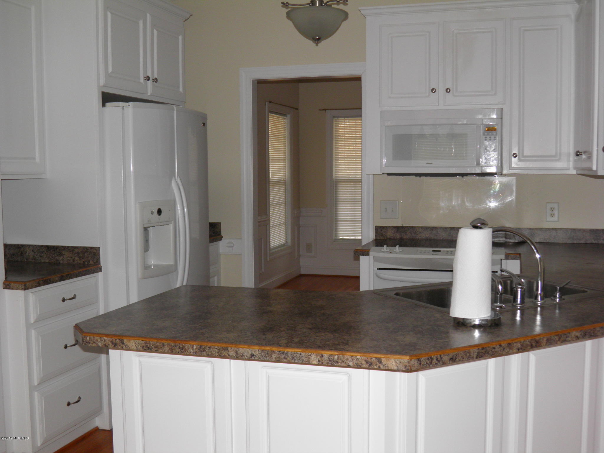 1700 Spring Pond Road Nashville, NC 27856 - Photo 7 of 19 Kitchen with entrance into the dining room